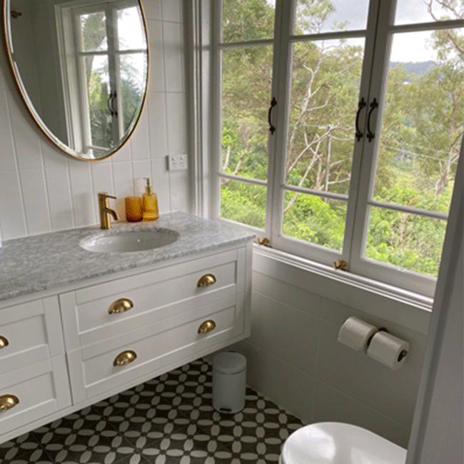 Bathroom with marble benchtop and tiled floors
